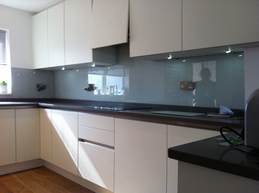Grey glass kitchen splashback with LED lighting in Kensington